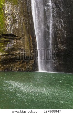 Sekumpul Waterfalls Surrounded By Tropical Forest In Bali, Indonesia.