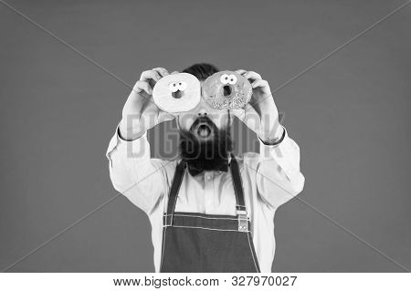 Tastiest Selection Of Doughnuts Around. Baker With Glazed Doughnuts. Bearded Man Holding Ring Doughn