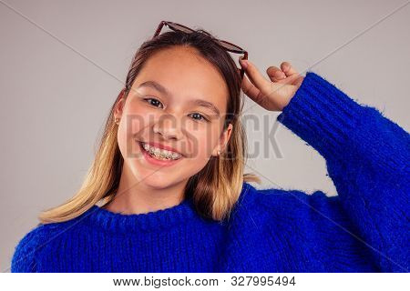 Closeup Braces Smile Portrait Of Caucasian Asian Smilling And Taking Selfie White Background Studio