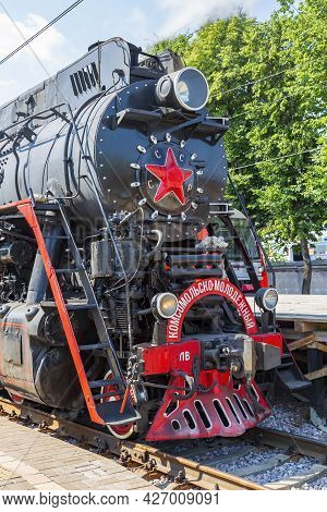 Black Retro Steam Locomotive At The Railway Station On A Sunny Day