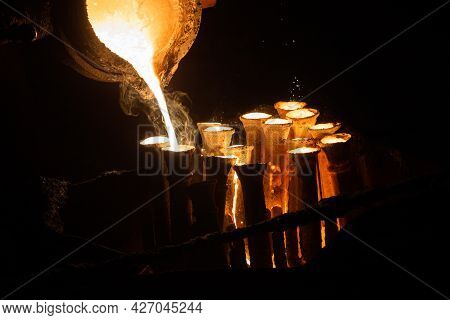 Industrial Lost Wax Casting. The Process Of Pouring For Filling Out Ceramic Shells With Molten Steel