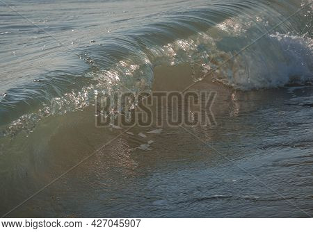 Colored Sea Waves With Splashes And White Breakers In Circeo Park, Sabaudia, Italy