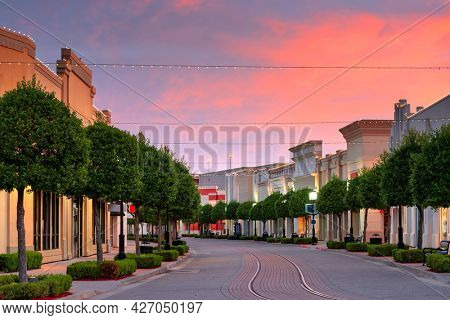Shreveport, Louisiana, USA downtown and shops at dusk.