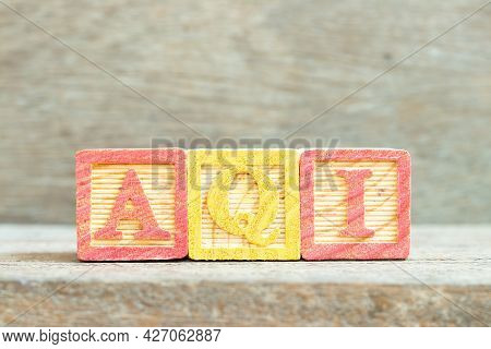 Color Alphabet Letter Block In Word Aqi (abbreviation Of Air Quality Index) On Wood Background
