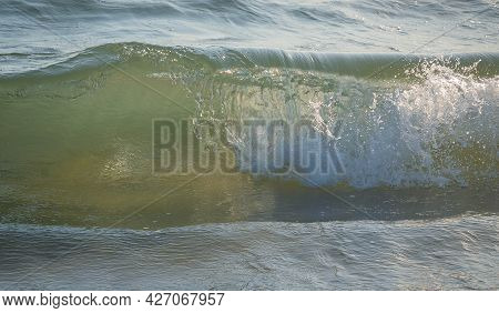 Colored Sea Waves With Splashes And White Breakers In Circeo Park, Sabaudia, Italy