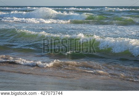 Colored Sea Waves With Splashes And White Breakers In Circeo Park, Sabaudia, Italy