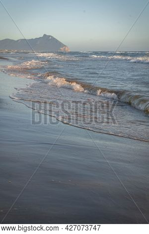 Colored Sea Waves With Splashes And White Breakers In Circeo Park, Sabaudia, Italy