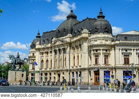 Bucharest, Romania, 6 May 2021: The Central University Library With Equestrian Monument To King Caro