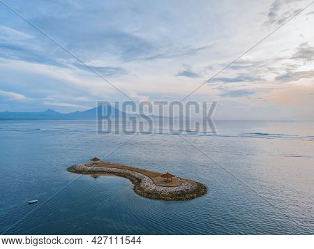 Sanur Beach On The Island Of Bali In Indonesia. Traditional Balinese Gazebos On The Island. An Iconi