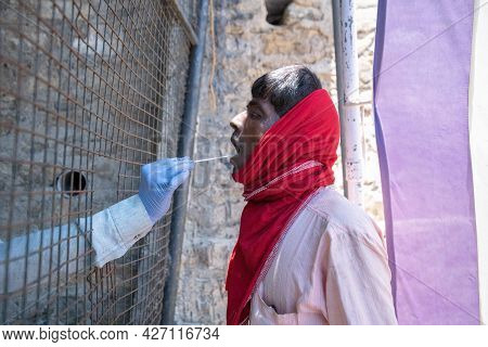 Pithoragarh, India, May, 2021 : A Migrant Worker Being Tested (rtpcr) For Covid-19.