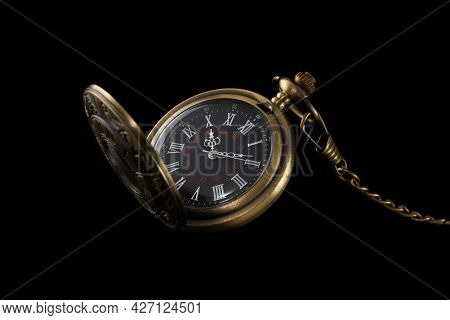 Old Pocket Mechanical Watch Isolated On Black Background. Fashoinable And Antique Accessory.