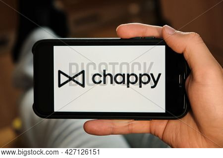 Chappy Logo Of Dating Application On The Screen Of Mobile Phone In Males Hand, June 2021, San Franci