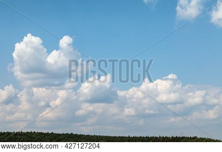 Summer Landscape. Lots Of Sky, Horizon Line And A Strip Of Forest. Upsized Texture Clouds. Backgroun