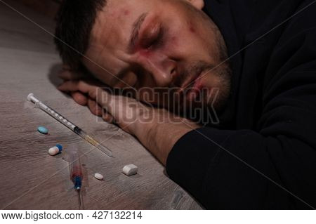 Overdosed Man Indoors, Focus On Different Drugs