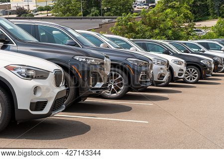 Monroeville, Pennsylvania, Usa July 18, 2021 Different Colored Bmw Suvs Lined Up Downhill At A Deale