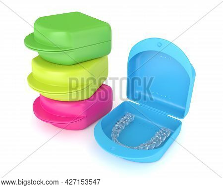 3d Render Of Clear And Removable Aligner With Cases Over White Background