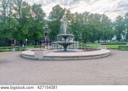 Zgorzelec, Poland - June 2, 2021: Water Fountain At Sunrise In City Park.