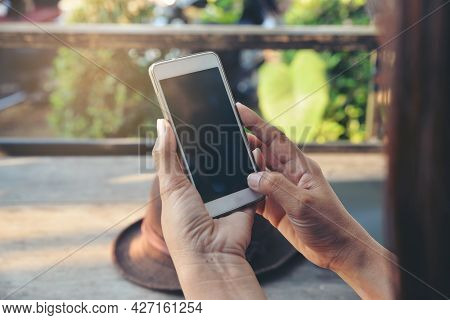 Woman\'s Hand Using Phone And Touch Screen At Home. Asian Woman Using Phone And Touch Screen, Happy 