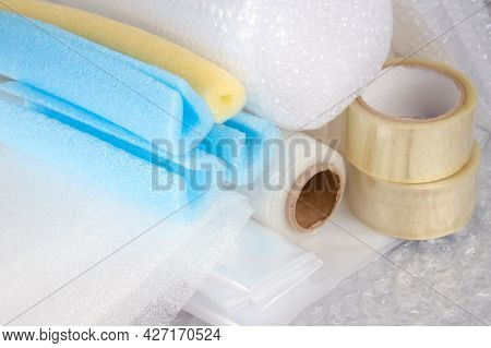 Set Of Plastic Packaging Materials - Plastic Stretch Film Rolls, Foamed Polyethylen Sheets And Rolls