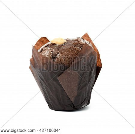 Baked Chocolate Muffis With Cream Wrapped In Brown Paper Isolated On White Background