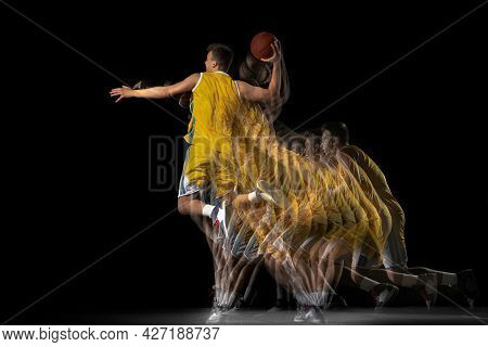 Young Caucasian Basketball Player In Motion And Action Isolated On Dark Background With Stroboscope 