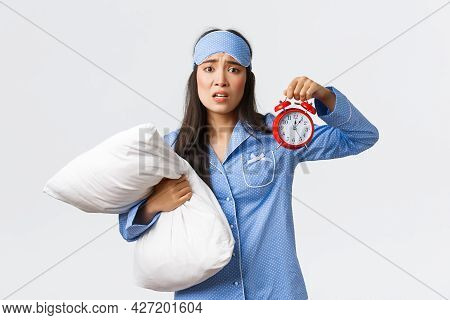 Concerned And Anxious Girl Looking With Panic As Showing Alarm And Holding Pillow, Waking-up Late, O