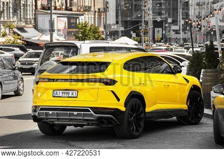 Kiev, Ukraine - May 22, 2021: Yellow Luxury Super Suv Lamborghini Urus In The City. Lamborghini Urus
