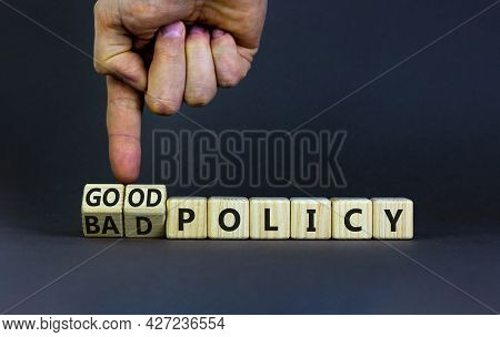 Good Or Bad Policy Symbol. Businessman Turns Wooden Cubes And Changes Words 'bad Policy' To 'good Po