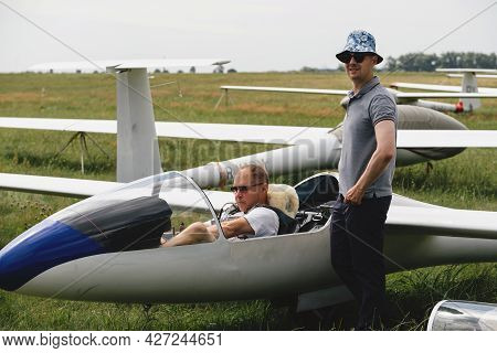 Soaring Club, Getting Ready For The Flight On Glider Airplane. Small Aviation Sport. Two Man Checkin