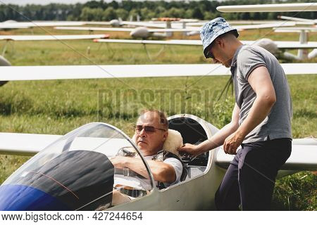 Soaring Club, Getting Ready For The Flight On Glider Airplane. Small Aviation Sport. Two Man Checkin