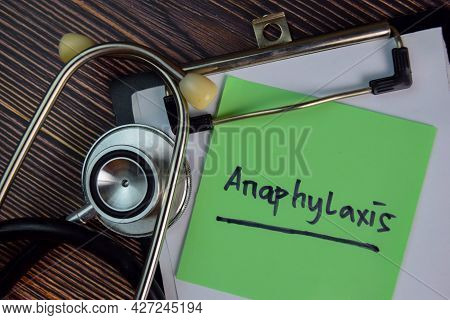 Anaphylaxis Write On Sticky Notes Isolated On Wooden Table.