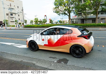 Fuji City, Shizuoka-ken, Japan - June 24, 2021: Tokyo 2020 Olympic Torch Relay. Car Parade With Part
