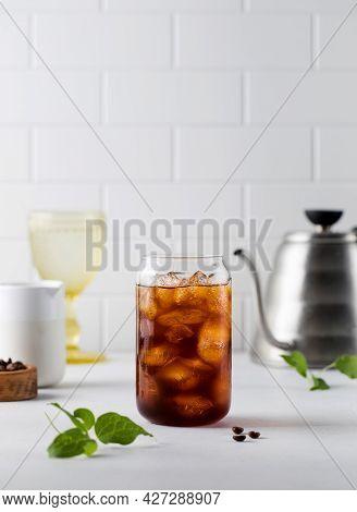 Cold Black Coffee With Ice Cubes On A White Background. Coldbrew. Summer Drinks.