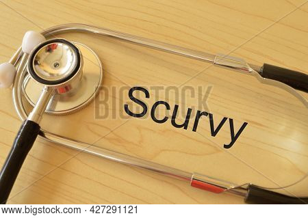 Stethoscope On The Table With Text Scurvy. Scurvy Is A Deficiency Disease That Results From Lack Of 