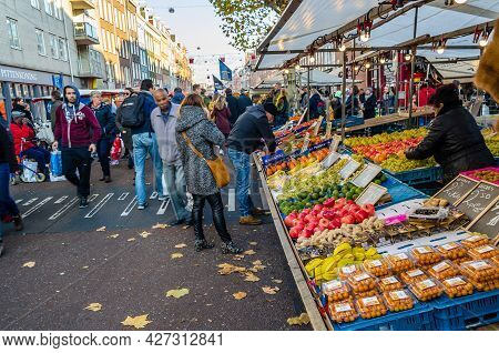 Amsterdam, The Netherlands - November 17, 2018: People Visiting The Albert Cuyp Market, A Street Mar