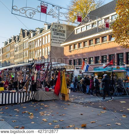 Amsterdam, The Netherlands - November 17, 2018: People Visiting The Albert Cuyp Market, A Street Mar
