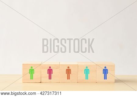 Different Color Of Human Symbol On Wooden Blocks. Different Skills And Different Abilities Concept.