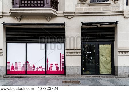 Madrid, Spain - March 7, 2021: Empty Closed Storefront In Serrano Street. The Coronavirus Pandemic H