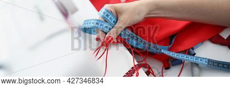 The Seamstress Holds Samples For Sewing Product