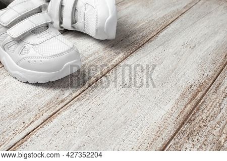 White Leather Sneakers On Light Background. Pair Of Fashion Trendy Childrens White Sneakers With Cop