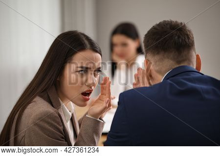Coworkers Bullying Their Colleague At Workplace In Office,