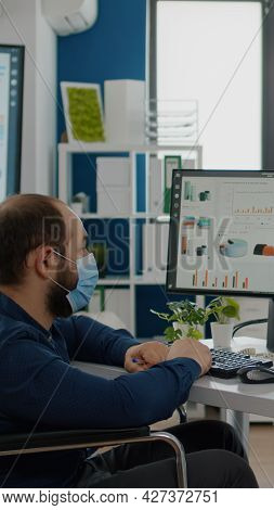 Handicapped Paralysed Invalid Entretreneur With Face Mask Explaning To Black Employee Financial Evol