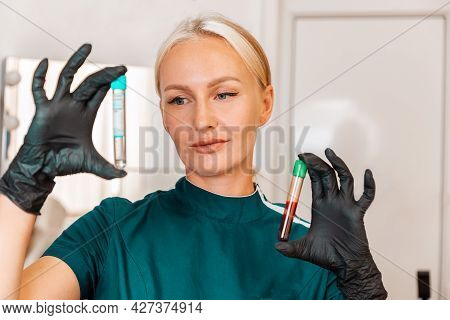 Plasmolifting. Beautician Holding Two Test Tubes With Blood And Without This. The Concept Of A Healt