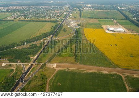 Land View Through The Airplane Window. Fields, Roads, Rivers From A Birds Eye View. Porthole. Look O