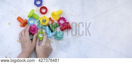 Educational Constructor For Children On Blue Background, Nuts And Bolts In The Form Of Geometric Sha
