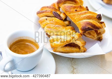 Traditional Italian Breakfast. Small White Cup Of Hot Caffe Ristretto And Two Fresh Croissant With A