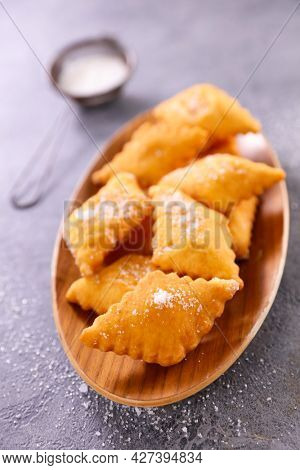 homemade fried bugne and sugar