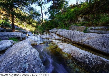 Large Granite Rocks With River Water Running Between Them. Navacerrada.