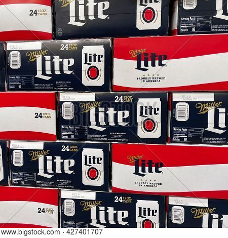 Cases Of Cans Of Miller Lite Beer At A Grocery Store Waiting For Customers To Purchase.
