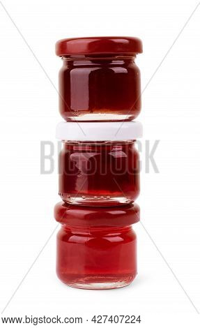 Front View Of Set Of Small Jam And Vegetable Jars In Different Colors Without Labels And Shiny Metal